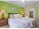 Comfortable bedroom featuring a queen bed, bedside table and walk in closet at 8507 Crystal Cove Loop, Kissimmee, FL 34747