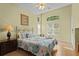 Inviting primary bedroom with a ceiling fan, complemented by large windows offering great natural light at 8507 Crystal Cove Loop, Kissimmee, FL 34747
