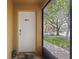 Front entry door with welcome mat and digital entry lock in an outdoor entryway at 8507 Crystal Cove Loop, Kissimmee, FL 34747
