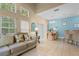 Open concept living and dining area boasts lots of natural light, neutral walls and stylish furnishings at 8507 Crystal Cove Loop, Kissimmee, FL 34747