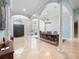 Formal dining room with grand pillars, chandelier, and dark wood dining set at 8531 Cypress Hollow Ct, Sanford, FL 32771