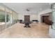 Spacious game room featuring a ping pong table, foosball, and outdoor access at 8531 Cypress Hollow Ct, Sanford, FL 32771