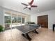 Game room with table tennis and sliding glass doors to the outdoor patio at 8531 Cypress Hollow Ct, Sanford, FL 32771
