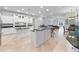Expansive white kitchen with granite countertops, double islands, and stainless steel appliances at 8531 Cypress Hollow Ct, Sanford, FL 32771