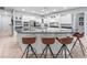 Open kitchen with bar stool seating, stainless steel appliances, and plenty of counter space at 8531 Cypress Hollow Ct, Sanford, FL 32771