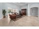 Inviting living room featuring leather seating, decorative rug, and view to the outdoor living space at 8531 Cypress Hollow Ct, Sanford, FL 32771
