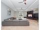 Bright living room with entertainment center, comfortable seating, and large windows at 8531 Cypress Hollow Ct, Sanford, FL 32771