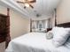 The main bedroom has a cozy seating area, high ceilings, and views to the backyard at 8531 Cypress Hollow Ct, Sanford, FL 32771