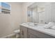 Well-lit bathroom with a spacious countertop, framed mirror and walk-in shower at 8928 Coconut Breeze Dr, Kissimmee, FL 34747