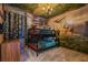Themed bedroom with bunk beds, dinosaur wallpaper, and unique jungle-themed ceiling decor at 8928 Coconut Breeze Dr, Kissimmee, FL 34747