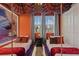 Themed bedroom with two twin beds, a shared nightstand, and a light up mural on the orange wall at 8928 Coconut Breeze Dr, Kissimmee, FL 34747