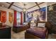 Themed bedroom featuring two twin beds, a brick accent wall, and a Hogwarts mural on the wall at 8928 Coconut Breeze Dr, Kissimmee, FL 34747