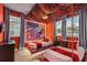 This themed bedroom features an elaborate hanging canopy, two twin beds, and a colorful mural on the wall at 8928 Coconut Breeze Dr, Kissimmee, FL 34747