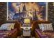 This themed bedroom features two twin beds, brick accent walls, and a mural behind the beds at 8928 Coconut Breeze Dr, Kissimmee, FL 34747