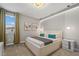 Comfortable bedroom with a king sized bed, modern furniture and neutral decor at 8928 Coconut Breeze Dr, Kissimmee, FL 34747
