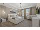 Bright and airy bedroom featuring a modern bed, a crib, and plenty of natural light at 8928 Coconut Breeze Dr, Kissimmee, FL 34747