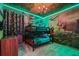 Themed bedroom with bunk beds, dinosaur wallpaper, and unique jungle-themed ceiling decor at 8928 Coconut Breeze Dr, Kissimmee, FL 34747