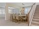 Beautiful dining room with stylish chairs and elegant decor near stairway at 8928 Coconut Breeze Dr, Kissimmee, FL 34747