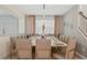 Elegant dining room with seating for twelve, adorned with stylish lighting and decor at 8928 Coconut Breeze Dr, Kissimmee, FL 34747