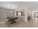 Game room view showcasing pool table and transition to dining area and stairway at 8928 Coconut Breeze Dr, Kissimmee, FL 34747
