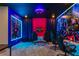 Spacious game room with multiple gaming stations and custom superhero themed wall murals at 8928 Coconut Breeze Dr, Kissimmee, FL 34747