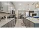 Well-equipped kitchen with stainless appliances, breakfast bar, and ample counter space at 8928 Coconut Breeze Dr, Kissimmee, FL 34747