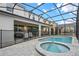 Backyard pool and spa with fenced enclosure, covered lanai, and ample seating offers an entertainer's paradise at 8928 Coconut Breeze Dr, Kissimmee, FL 34747