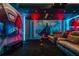 Theater room with a large screen, comfortable seating, and a Star Wars themed mural at 8928 Coconut Breeze Dr, Kissimmee, FL 34747