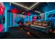 Themed theater room with comfortable seating, large screen, and immersive decor at 8928 Coconut Breeze Dr, Kissimmee, FL 34747
