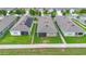 Backyard aerial view of a fenced property with a screened-in patio and green grass at 927 Denali Dr, Orange City, FL 32763