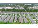 Aerial view of a residential neighborhood near shopping centers and mature trees at 927 Denali Dr, Orange City, FL 32763