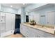 Bright bathroom features granite counters, dual sinks, and walk-in shower at 927 Denali Dr, Orange City, FL 32763