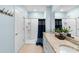 Bathroom featuring granite countertop, dual sinks, and a shower at 927 Denali Dr, Orange City, FL 32763