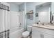 Well-lit bathroom featuring a shower and tub combination and granite vanity at 927 Denali Dr, Orange City, FL 32763
