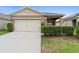 Charming single-Gathering home featuring a two-car garage and well-maintained landscaping at 927 Denali Dr, Orange City, FL 32763