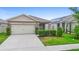 Inviting single-story home with a neatly maintained lawn and a convenient two-car garage at 927 Denali Dr, Orange City, FL 32763