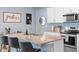 Kitchen area with granite countertops and island with barstool seating at 927 Denali Dr, Orange City, FL 32763