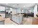 Open concept kitchen with a granite island, stainless steel appliances, and dining area at 927 Denali Dr, Orange City, FL 32763