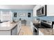 Bright and airy kitchen with granite countertops and stainless steel appliances at 927 Denali Dr, Orange City, FL 32763