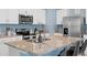 Well-appointed kitchen with stainless steel appliances, granite countertops, and white cabinets at 927 Denali Dr, Orange City, FL 32763