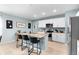 Beautiful kitchen featuring an island with barstool seating, granite countertops, and stainless steel appliances at 927 Denali Dr, Orange City, FL 32763