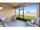 Relaxing screened porch with comfortable seating overlooking the fenced backyard at 927 Denali Dr, Orange City, FL 32763