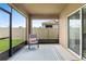 Cozy screened porch overlooking the backyard with access to the outdoors at 927 Denali Dr, Orange City, FL 32763