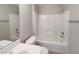 This bathroom features a combination shower-tub, white vanity, and a toilet at 9514 Se 168Th Maplesong Ln, The Villages, FL 32162