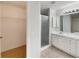 Neutral bathroom featuring tile flooring, white cabinet and walk-in shower at 9514 Se 168Th Maplesong Ln, The Villages, FL 32162
