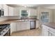Bright kitchen features stainless appliances, light countertops, and lots of cabinet space at 9514 Se 168Th Maplesong Ln, The Villages, FL 32162