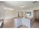 Kitchen with white cabinets and a large countertop island that provides extra work space at 9514 Se 168Th Maplesong Ln, The Villages, FL 32162