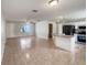 Spacious living area with tile floors, neutral walls, and an eat-in kitchen at 9514 Se 168Th Maplesong Ln, The Villages, FL 32162