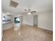 Bright, open living space with tile flooring and access to an outdoor patio at 9514 Se 168Th Maplesong Ln, The Villages, FL 32162
