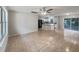 Open-concept living space with tile flooring, neutral paint, and an abundance of natural light at 9514 Se 168Th Maplesong Ln, The Villages, FL 32162
